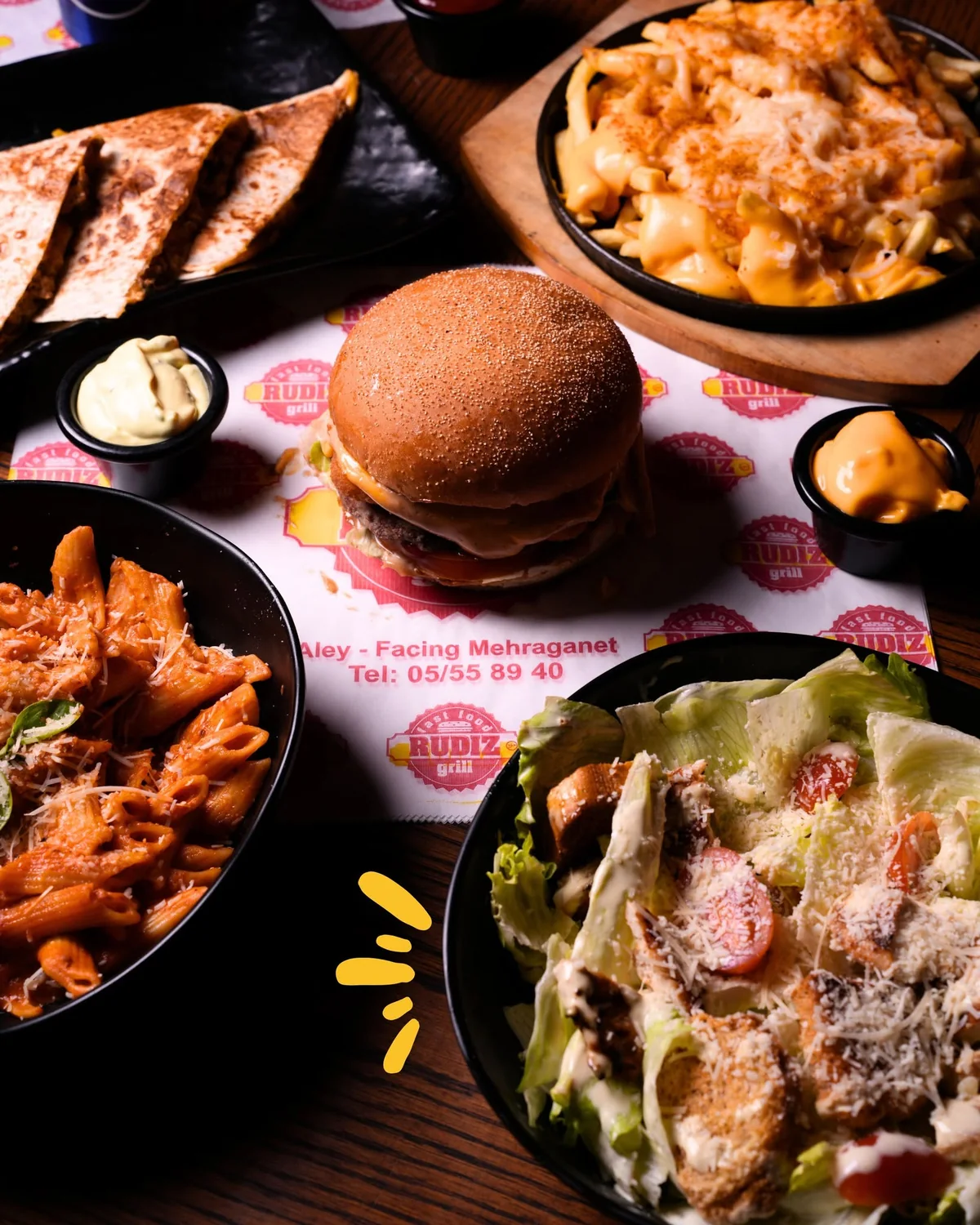 RUDIZ spread with burger, fries and loaded dish