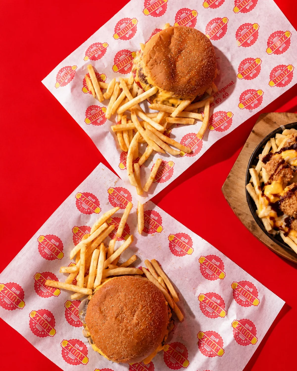 RUDIZ burger and fries on branded paper